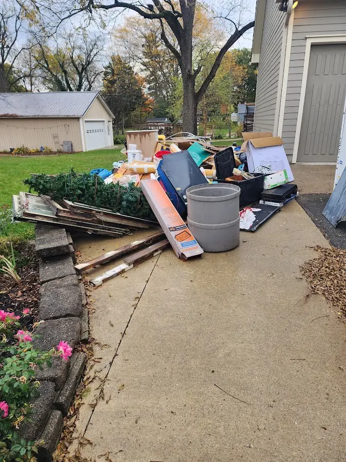 Dumpster being loaded with debris for 10 Yard Dumpster Rental in Winthrop Town